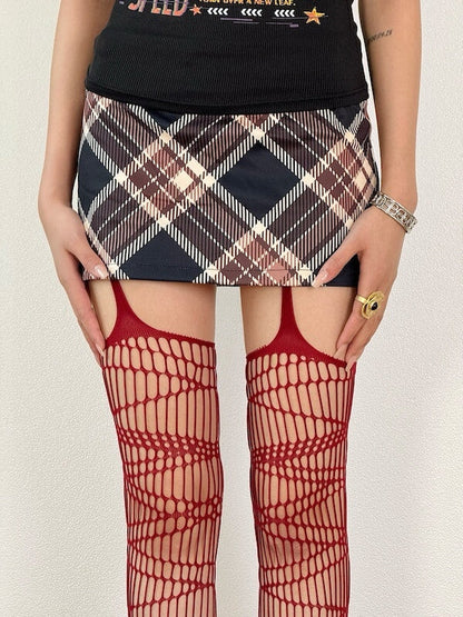 Dark punk strap ripped fishnet tights