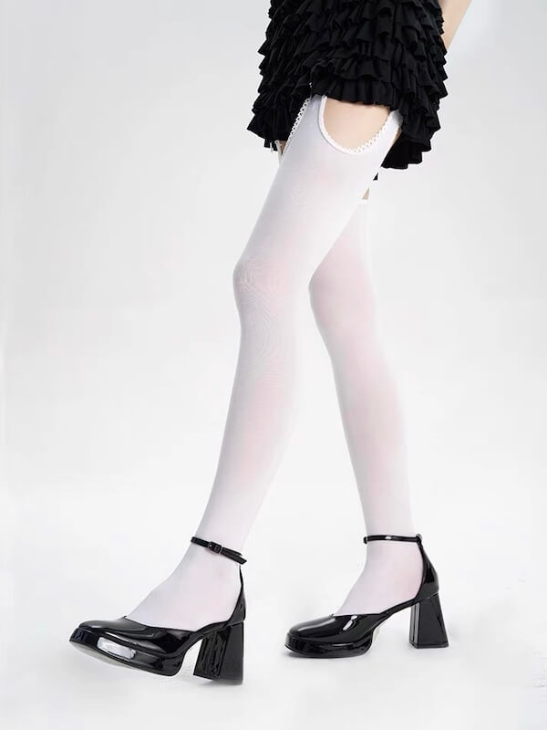 Thigh-high ripped tights with faux suspenders