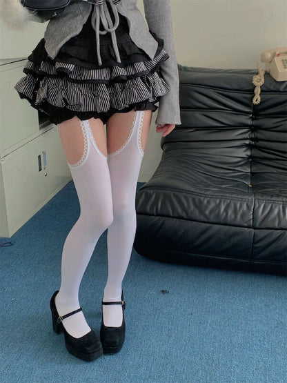 Thigh-high ripped suspender stockings tights