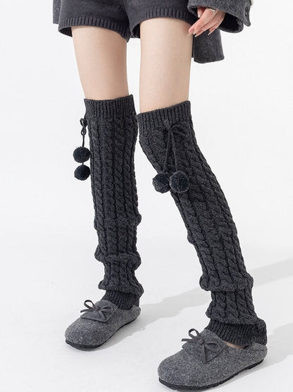 Pompon twisted over knee leg warmers