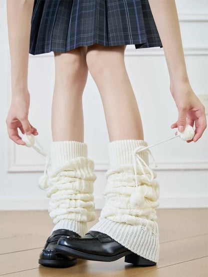 Pompon twisted over knee leg warmers